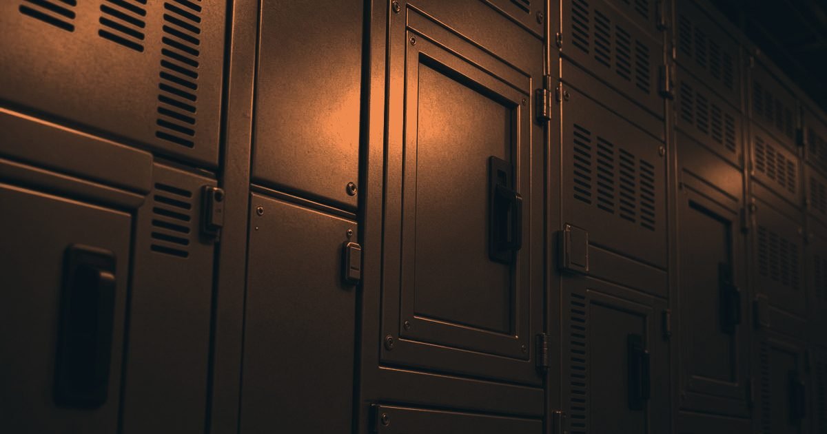 A commercial switch room with steel switchgear panels in a charcoal and orange duotone