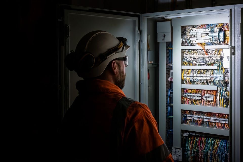 Electrical engineer at a commercial distribution panel